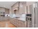 Well-equipped kitchen with stainless steel appliances, ample cabinet space, and a gas cooktop at 7358 Bay Cove Ct, Denver, NC 28037