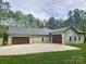 Spacious home with multiple garages and ample parking space in the backyard at 7358 Bay Cove Ct, Denver, NC 28037