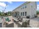 Spacious outdoor patio featuring comfortable seating, outdoor grill, and scenic views of the backyard at 7405 Albemarle Dr, Denver, NC 28037