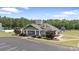 Beautiful community clubhouse with craftsman details, lovely landscaping, and easy access to parking at 7405 Albemarle Dr, Denver, NC 28037