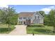 Charming two-story home with a well-manicured lawn, inviting curb appeal, and traditional architectural design at 7405 Albemarle Dr, Denver, NC 28037