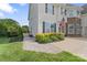 Charming walkway leads to the home's entrance, complemented by manicured landscaping and verdant lawn at 7405 Albemarle Dr, Denver, NC 28037