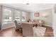The bright living room is filled with light and has hardwood floors at 7405 Albemarle Dr, Denver, NC 28037