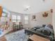 Cozy living room with a comfortable seating area, decorative wall art, and natural light at 7405 Albemarle Dr, Denver, NC 28037