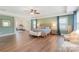 Spacious main bedroom features hardwood floors, tray ceilings, seating area and exercise equipment at 7405 Albemarle Dr, Denver, NC 28037