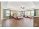 Spacious main bedroom features hardwood floors, tray ceilings, and ample natural light at 7405 Albemarle Dr, Denver, NC 28037