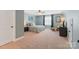 Spacious main bedroom with a seating area, plush carpet, and large windows for natural light at 7405 Albemarle Dr, Denver, NC 28037