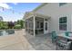 A screened in patio and a stone patio are located just off the pool at 7405 Albemarle Dr, Denver, NC 28037
