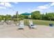 Relaxing backyard patio with lounge chairs and umbrella, perfect for outdoor living at 7405 Albemarle Dr, Denver, NC 28037