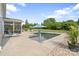 Inviting pool with an umbrella, screened porch, and lounge chairs, set in a spacious backyard at 7405 Albemarle Dr, Denver, NC 28037