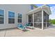 Comfortable screened porch with ceiling fan and outdoor furniture, adjacent to lounge chairs at 7405 Albemarle Dr, Denver, NC 28037