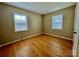 Bright bedroom with hardwood floors and ample natural light at 8205 Meadowind Cir, Charlotte, NC 28226