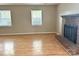 Spacious living room features a brick fireplace, hardwood floors, and natural light at 8205 Meadowind Cir, Charlotte, NC 28226