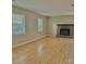 Comfortable living room with large windows and a brick fireplace at 8205 Meadowind Cir, Charlotte, NC 28226