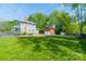 Large grassy backyard with a detached garage and plenty of space for outdoor activities at 822 W Front St, Statesville, NC 28677