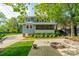 Beautiful home featuring a spacious back patio with a fire pit, perfect for outdoor enjoyment at 822 W Front St, Statesville, NC 28677