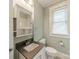 Bathroom with white vanity and tile floors at 822 W Front St, Statesville, NC 28677