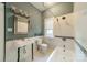 Charming bathroom featuring classic black-and-white tiled floors and a vintage-style sink at 822 W Front St, Statesville, NC 28677