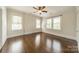 Bedroom with hardwood floors, lots of natural light and ceiling fan at 822 W Front St, Statesville, NC 28677
