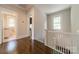 Bright hallway with beautiful wood floors leads to the bathroom and other rooms of this home at 822 W Front St, Statesville, NC 28677