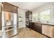 Bright kitchen features stainless steel appliances, granite counters, tile flooring, and a double oven at 822 W Front St, Statesville, NC 28677