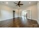 Expansive living room with hardwood flooring and an open layout to the adjacent rooms at 822 W Front St, Statesville, NC 28677