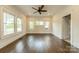 Sunny living room with hardwood floors and a wall of windows providing ample natural light at 822 W Front St, Statesville, NC 28677