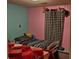 Colorful bedroom featuring hardwood floors, twin beds and closet at 8524 Stoneman Pl, Charlotte, NC 28217