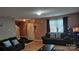 Welcoming living room with a staircase, comfortable couches, and warm wood floors at 8524 Stoneman Pl, Charlotte, NC 28217