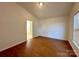 Inviting bedroom with a vaulted ceiling and durable wood-look flooring at 8551 Appledale Dr, Charlotte, NC 28262