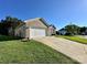 Lovely home with a two-car garage, a well-kept lawn and easy driveway access at 8551 Appledale Dr, Charlotte, NC 28262