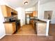 Well-organized kitchen with modern appliances, warm wood cabinets, and convenient breakfast bar seating at 8551 Appledale Dr, Charlotte, NC 28262