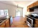 Functional kitchen equipped with modern appliances, laminate countertops, and backyard views at 8551 Appledale Dr, Charlotte, NC 28262