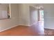 Inviting living area featuring durable flooring and neutral paint, leading to an outdoor space at 8551 Appledale Dr, Charlotte, NC 28262