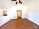 Spacious, naturally lit living room with wood floors and seamless hallway access at 8551 Appledale Dr, Charlotte, NC 28262