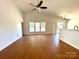 Bright living room featuring wood floors, vaulted ceilings, and natural light through large windows at 8551 Appledale Dr, Charlotte, NC 28262