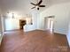 Open-concept living space with hardwood floors, opening into the kitchen and hallway at 8551 Appledale Dr, Charlotte, NC 28262