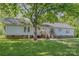 Charming one-story home with a light-colored exterior and a well-manicured lawn at 940 Hatchett Rd, Lincolnton, NC 28092