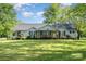Charming single-story home with a well-manicured lawn and covered front porch at 940 Hatchett Rd, Lincolnton, NC 28092