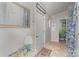 Hallway view of front door and interior bathroom/laundry area at 940 Hatchett Rd, Lincolnton, NC 28092