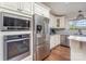 Gourmet kitchen featuring stainless steel appliances, custom cabinets, and marble countertops at 940 Hatchett Rd, Lincolnton, NC 28092