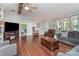 Spacious living room with hardwood floors, bright windows and access to bedroom through sliding door at 940 Hatchett Rd, Lincolnton, NC 28092