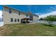 Large backyard with a covered patio, offering a great outdoor living space at 9613 Fire Bellied Ct, Lancaster, SC 29720