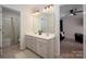 Updated bathroom featuring a double sink vanity and access to the tub/shower combo at 9613 Fire Bellied Ct, Lancaster, SC 29720