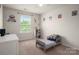 This bedroom is adorned with sports themed decor, and has great natural light at 9613 Fire Bellied Ct, Lancaster, SC 29720