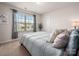 Sun-filled bedroom featuring a large window with neighborhood views, and neutral walls at 9613 Fire Bellied Ct, Lancaster, SC 29720