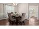 Elegant dining room with hardwood floors, wainscoting, and a view into the office at 9613 Fire Bellied Ct, Lancaster, SC 29720