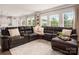 Spacious living room features a sectional sofa, area rug, and views to the backyard at 9613 Fire Bellied Ct, Lancaster, SC 29720