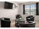 Cozy living room with black chairs, round table and large window for natural light at 9613 Fire Bellied Ct, Lancaster, SC 29720