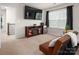 Bright living room with a TV and a mini fridge near to the window for modern convenience at 9613 Fire Bellied Ct, Lancaster, SC 29720